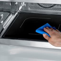 Magnetron met heteluchtfunctie - Magnetron en oven - Maaltijden snel bereiden - Glazen bodem zonder draaiplateau - 25 Liter - Zwart RVS — thumbnail 3