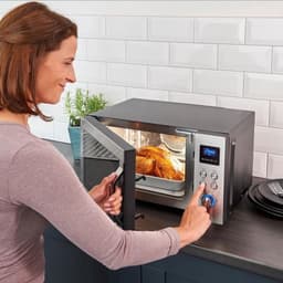 Magnetron met heteluchtfunctie - Magnetron en oven - Maaltijden snel bereiden - Glazen bodem zonder draaiplateau - 25 Liter - Zwart RVS — thumbnail 2